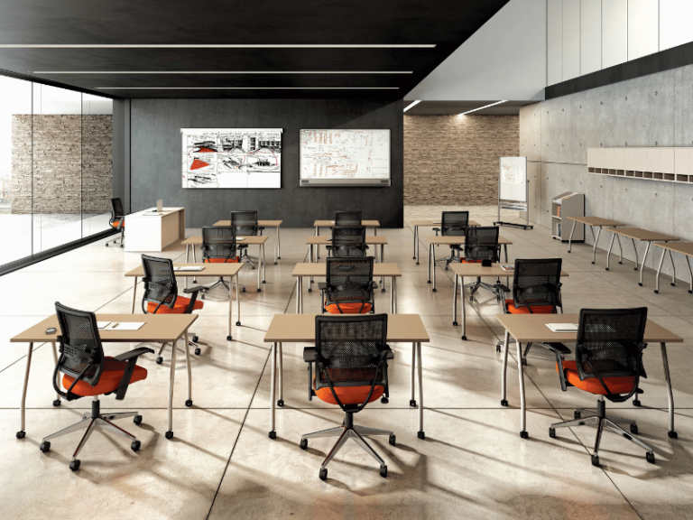 A modern classroom featuring tables and chairs that are on casters making this a flexible education design.