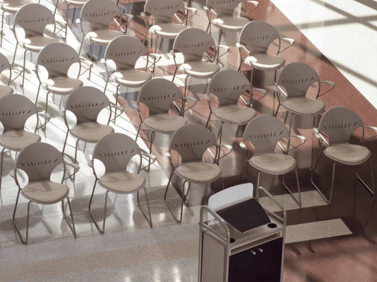 A lecture hall with round back chairs that bring elegant lines to this education design.