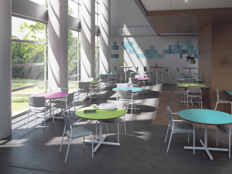 Colorful round tables with metal frame chairs that feature a square back bring fun to education design.