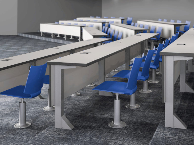 A lecture hall with tier tables and blue swivel chairs.