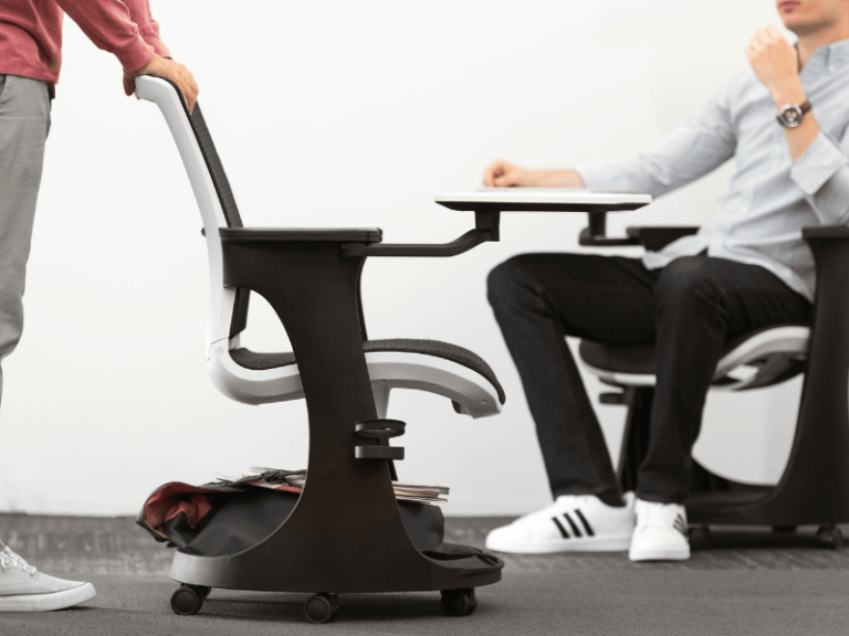 Ergonomic office seating on wheels featuring a laptop arm.